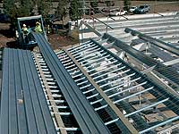 &ldquo;On-site roll forming was the answer, but the roll forming mill also had to have the capability to output sheets directly to the roof frame, so that we could avoid having to use multiple cranes to lift them into position.&rdquo;