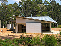 Bush Retreat on NSW south coast features roofing and walling made from ZINCALUME® steel and a steel framing which was chosen as they are bushfire and termite proof and touch the earth lightly.