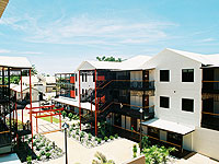 LYSAGHT CUSTOM ORB® profile in the COLORBOND® steel colour Surfmist® was used to clad the walls and roof of this development in the Chinatown precinct of Broome, Western Australia.