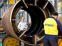 Steve Edmunds of heavy engineering company Haywards with a section of a Melbourne project, the Southern Star Observation Wheel, comprising mostly Grade 350 XLERPLATE&reg; steel.