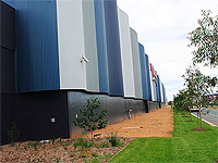 The striking walls of the SPC Ardmona warehouse in Shepparton are clad in LYSAGHT CUSTOM ORB&reg; sheet sheeting.