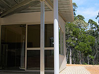 External cladding on the bush retreat features LYSAGHT MINI ORB&reg; profile in ZINCALUME&reg; steel together with flat sheets of ZINCALUME&reg; steel fixed over fibre cement sheeting for contrast. Steel  wall framing and roof trusses are also used.