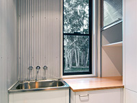This family holiday home at Pindimar Bay on the north shore of Port Stephens, New South Wales uses LYSAGHT MINI ORB® profile in ZINCALUME® steel applied to laundry and WC walls.