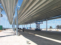 This cattle pavilion's roof is made from 144 metre long continuously rolled ARAMAX roof panels made from GALVASPAN® G550 steel.