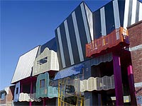 Victorian College of Arts, the School of Drama uses LYSAGHT MINI ORB&reg;, LYSAGHT KLIP-LOK 406&reg;, and LYSAGHT TRIMDEK&reg; made from COLORBOND&reg; steel in colours, Night Sky&reg;, Paperbark&reg; and Deep Ocean&reg;, as well as COLORBOND&reg; Metallic steel in colours Conservatory&reg; and Skybridge&reg;.