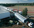 BlueScope Lysaght’s mobile
roll former tilts up to produce the 103 metre lengths of roof cladding for the Blacktown Olympic Park grandstand.