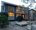 This family holiday home at Pindimar Bay on the north shore of Port Stephens, New South Wales uses LYSAGHT CUSTOM ORB® roofing and wall cladding in colours Jasper®, Dune® and Ironstone®.