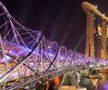The Helix Bridge makes a dramatic foreground to the imposing Marina Bay Sands, Singapore, a 581,400 square metre integrated resort which uses XLERPLATE&reg; steel.