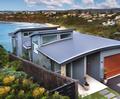 The Wallich House located in Newport, NSW, uses roofing made from COLORBOND® Ultra steel in the colour Woodland Grey®
