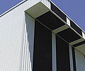 Alternating sheets of LYSAGHT INTEGRITY&reg; 820 in Night Sky&reg; and Surfmist&reg; provide a barcode graphic.