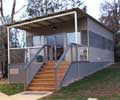 Shakespeare Centre for Scouting at Camp Cottermouth, ACT features modular buildings with roofing made from COLORBOND&reg; steel in colour Dune&reg; and walling in the colours Bushland&reg; and Woodland Grey&reg;.