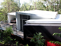 This Sunshine Coast home is a unique design clad almost entirely in LYSAGHT CUSTOM ORB® profile roll formed in ZINCALUME®  steel.
