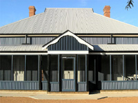 Kameruka Homestead which has been restored using LYSAGHT CUSTOM ORB® in Deep Ocean® COLORBOND® steel for the cladding.