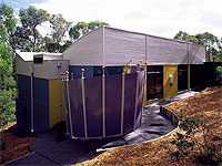 Curved roof sections made from COLORBOND® steel in Dune®, and skillion roofing made from ZINCALUME® steel.