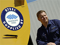 Daniel Parker of Parker Silos and Sheetmetal with his Wildcat Chaser Bins