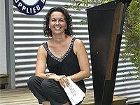 Kelly McDonald, of Queensland company Frontyard Art, with one of her company’s ZINCALUME® steel letterboxes in the SPIKE range.