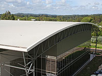 Curved roof made from LYSAGHT KLIP-LOK 700 HI-STRENGTH® concealed fix cladding which was rollformed directly to the roof frame by BlueScope Lysaght’s mobile rollforming rig.