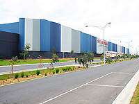 The striking walls of the SPC Ardmona warehouse in Shepparton are clad in LYSAGHT CUSTOM ORB&reg; sheet sheeting.