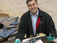 Agpoint National Sales Manager John Thompson with some of the farm tools his company produces using more than 2000 tonnes of XLERPLATE® steel coil plate and XLERCOIL® steel a year.