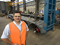 Jim Xidis of Brentwood Trailers, a member of the STEEL BY&trade; Brand Partnership Program, with a low loader