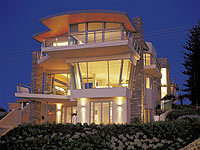 Sprung curved roof made from LYSAGHT CUSTOM ORB® in COLORBOND® Stainless steel was on this North Beach home in Perth
