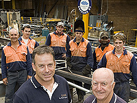 Ian Mitchell (left), his father Ken, and the team from Ken Mitchell Engineering, a member of the STEEL BY™ Brand Partnership Program.