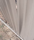 Place 2nd sheet into bottom rail, ensuring there is sufficient overlap
