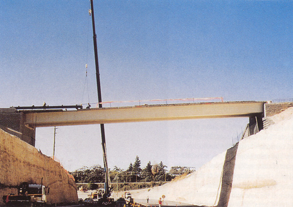 Appian Way Bridge Spanning the Great Western Highway at Woodford Bends, New South Wales. It comprises twin steel troughs with a composite reinforced concrete slab deck.