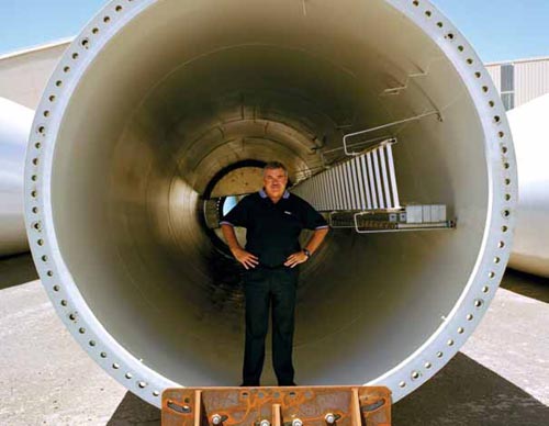 Keppel Prince Engineering General Manager Steve Garner, inside a wind tower made from XLERPLATE® steel. The wind towers will be located at Challicum Hills wind farm near Ararat, Vic.