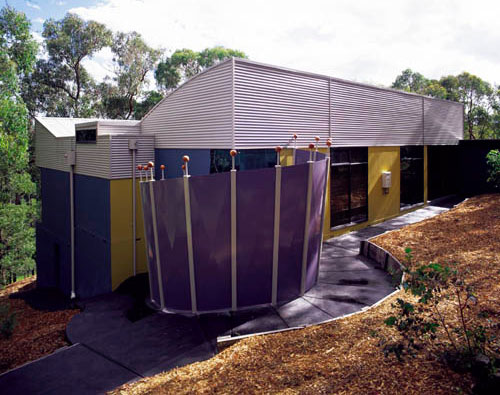 Curved roof sections made from COLORBOND® steel in Dune®, and skillion roofing made from ZINCALUME® steel.