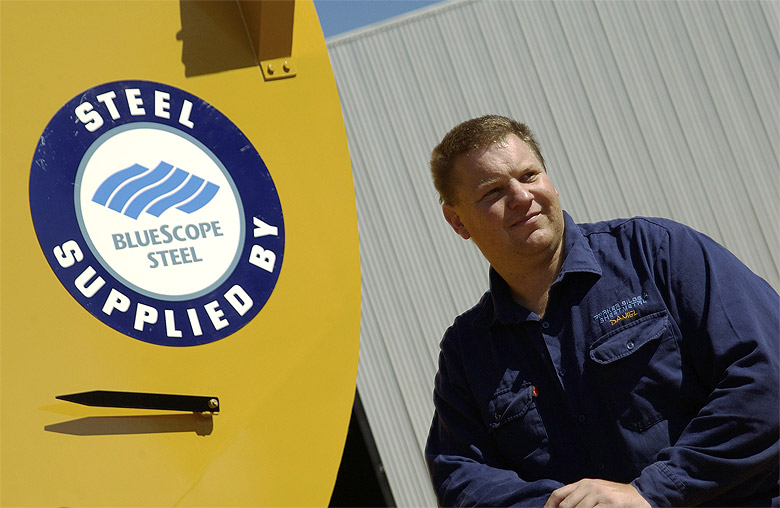 Daniel Parker of Parker Silos and Sheetmetal with his Wildcat Chaser Bins