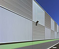 This warehouse in Greystanes, New South Wales displays a checkerboard effect using walling panels made from COLORBOND&reg; steel in the  LYSAGHT CUSTOM ORB&reg; profile.