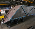 A belly-dumper trailer in the fabrication shop