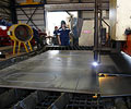 XLERPLATE? steel being fabricated into a belly-dumper trailer.