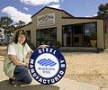 Leah Voigt from Meleah Kit Fabrications, a member of the STEEL BY™ Brand Partnership Program, outside a shed using the American barn design.