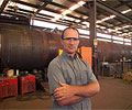 Steve Edmund, Managing Director of Haywards Engineering, manufacturing 60 metre high wind towers for a wind farm near Woolnorth, Tasmania. The towers are constructed of  XLERPLATE&reg; steel.