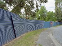 Continuous feature wall around Gawler Caravan Park using fencing made from COLORBOND® steel