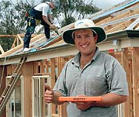 David Treloar of Bendigo-based Gary Clark Plumbing with GRAB STICK&reg;, a magnetic tool to clamp insulating paper to steel battens even when the wind reaches levels that would normally put a stop to roofing work.