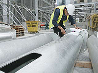 Pre-installation of column reinforcement in steel tubes prior to delivery at Latitude East Project, Sydney